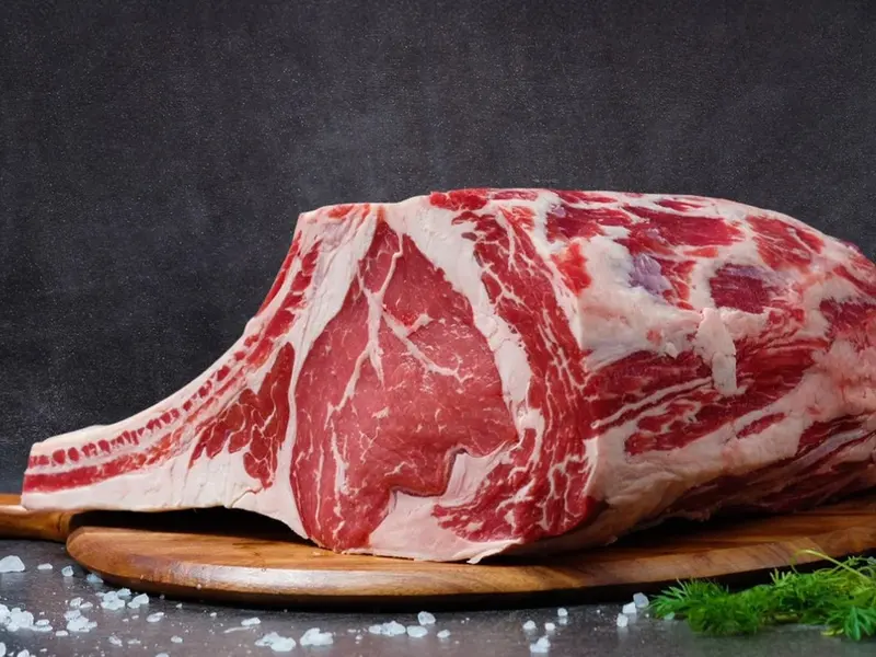 Bone-in ribeye on a cutting board